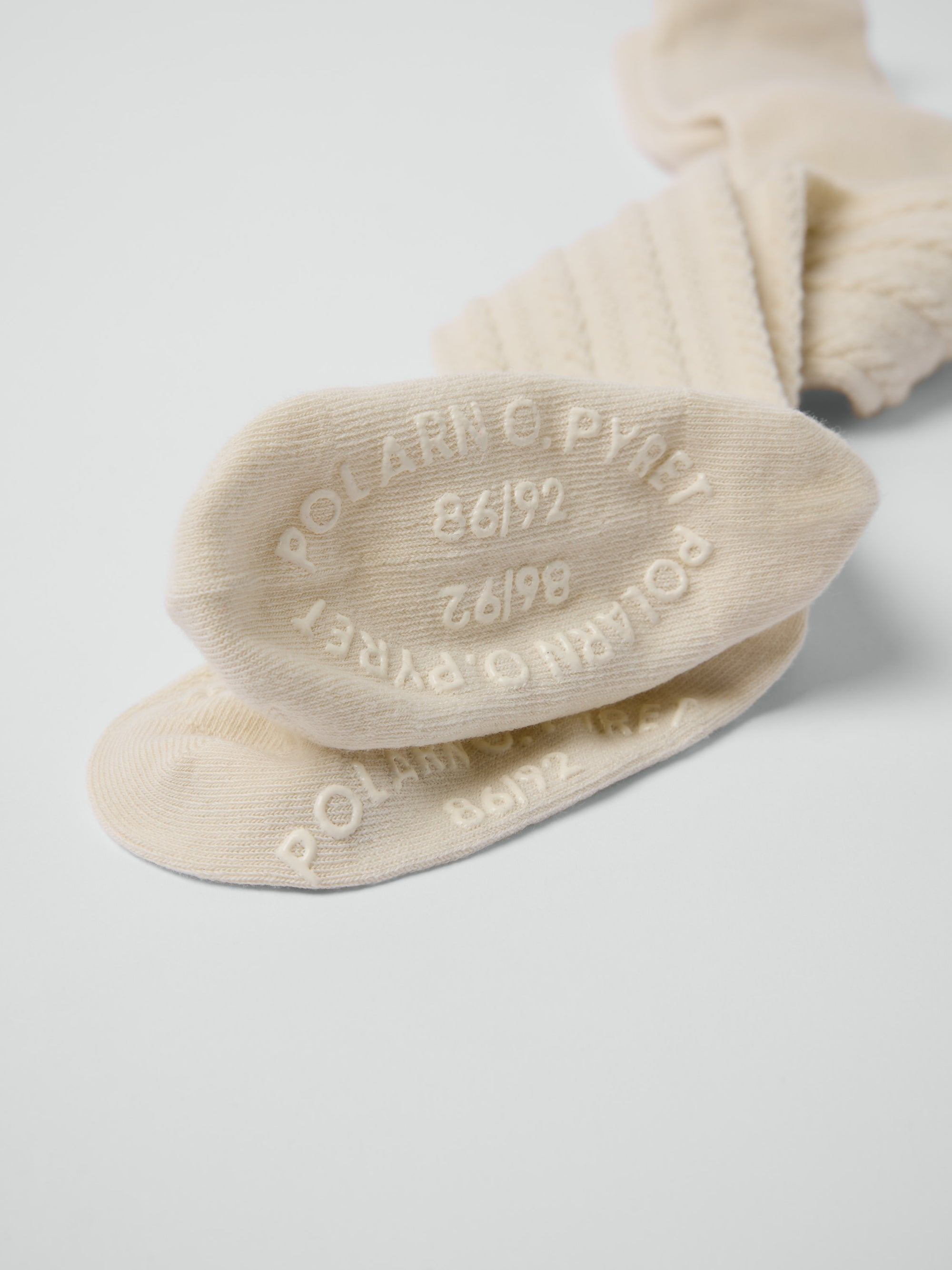 Kabelstickad strumpbyxa - Beige